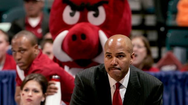 Arkansas Razorbacks head coach Stan Heath watches from the sidelines during the second half of a quarterfinal round SEC Tournament game against the Vanderbilt Commodores at the Georgia Dome in Atlanta.